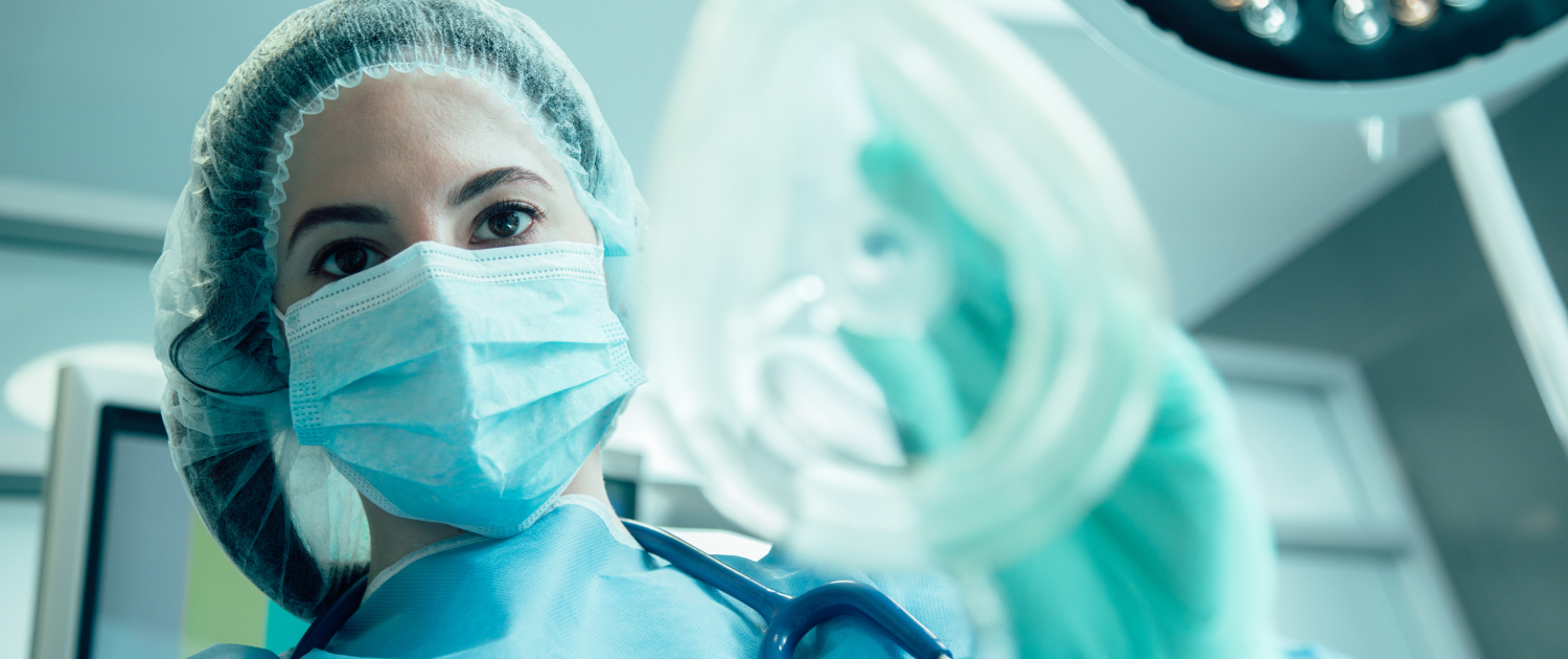 Experienced anesthesiologist doing her work stock photo
